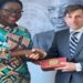 Mrs. Ursula Owusu-Ekuful, Minister for Communications presenting a gift to Mr Jean-Marc Sere-Chalet