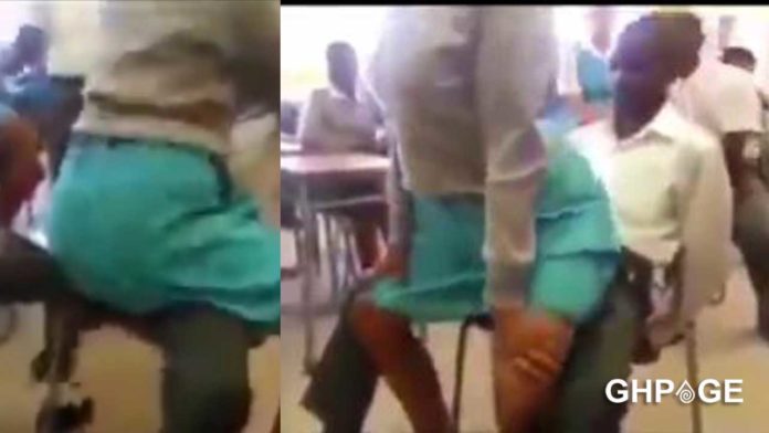 SHS girl giving her male colleague a lap-dance