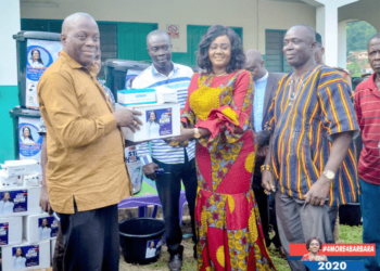Mrs Oteng-Gyasi (2nd right) presenting the items to Mr Tamakloe while the Chief of Bogoso, Nana Sumpre (extreme right), and Mr Abiam Kuntu Danso (middle), NPP Chairman of the Prestea Huni-Valley Constituency, look on