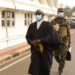 A military bodyguard carrying Attorney General Godfred Dame's bag