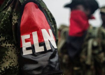 Members of the "Omar Gomez" Western War Front of the National Liberation Army (ELN) guerrilla line up in their camp on the banks of the San Juan River, Choco department, Colombia, on November 19, 2017.