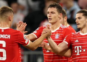 Benjamin Pavard celebrates with his Bayern Munich team-mates after scoring against Inter