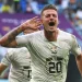 Sergej Milinkovic-Savic celebrates after putting Serbia in the lead at the end of the first half / Chris Brunskill/Fantasista/GettyImages