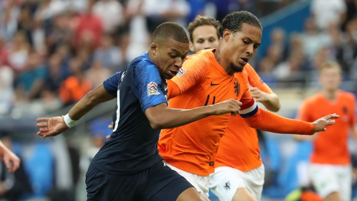 Virgil van Dijk and Kylian Mbappe tussle in a 2018 clash between the Netherlands and France