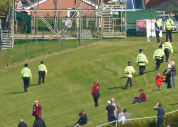 Police officers respond to Animal Rising activists attempting to invade the race course ahead of the Randox Grand National Handicap Chase during day three of the Randox Grand National Festival at Aintree Racecourse, Liverpool. Picture date: Saturday Ap...